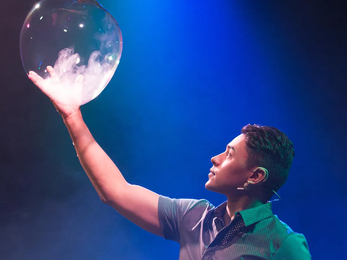 A smoke-filled bubble held up on stage